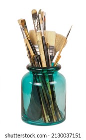 Various Professional Paint Brushes In The Green Glass Jar, Isolated On White Background