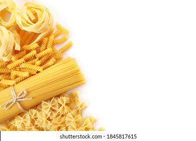 Various raw italian pasta on white background. Top view. Copy space.