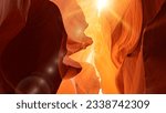 Various red and orange rocks in antelope canyon. Midday sun hits the antelope canyon whimsically illuminating canyon walls. Red walls of Antelope Canyon in Arizona, USA, United States