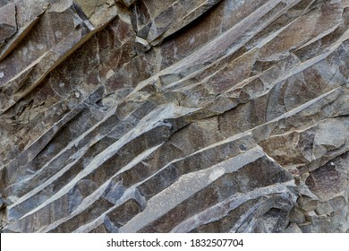 Various rock formation in geological layers in an abandoned quarry