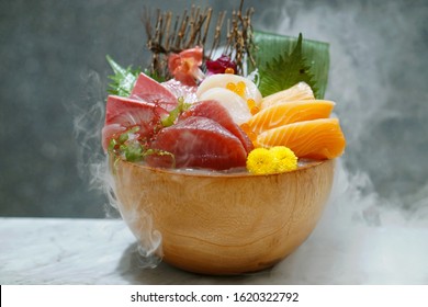Various Sashimi Set - Fresh Sliced Raw Fish With Tuna, Salmon, Scallop And Yellowtail, Topped With Wasabi And Shredded Radish, Served With Smoke Of Dry Ice, Japanese Traditional Food.