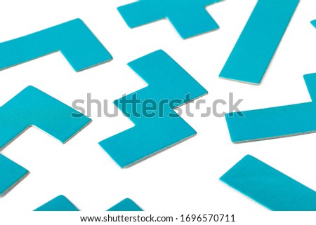 Various shapes, blue puzzle elements, pattern, white background abstract. Scattered unorganized parts, simple different unlinked disconnected figures, no connection, solving problems abstract concept