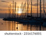 Various ships and boats in a marina of Thessaloniki, Greece at sunset