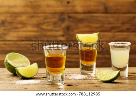 various shot with alcoholic drink on rustic background