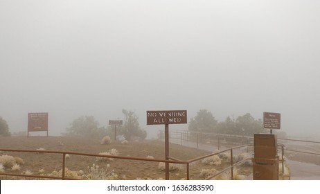 Various Signs At The Trailhead To The White House Ruins During Inclement Weather.