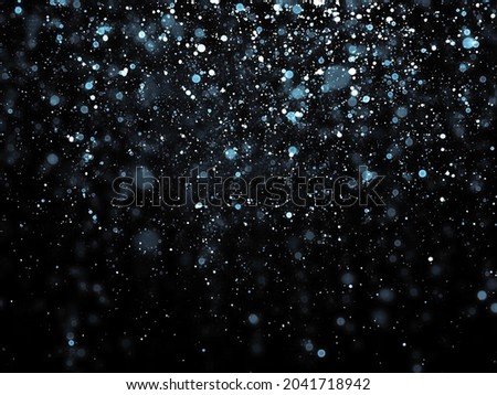 Various size of color dots. Shinny small particles reflecting light. Abstract glittering texture on black background.