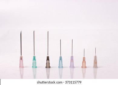 various size of syringe needles isolated on white