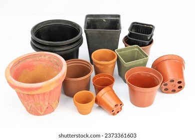 Various sizes, shapes and designs of plastic pots for plants isolated on white background - Shutterstock ID 2373361603