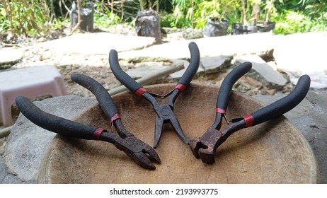 Various Small Black Pliers Made Of Steel