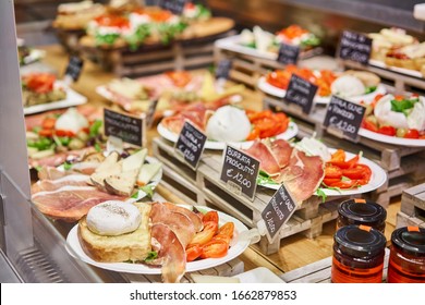 Various Snacks And Antipasti On The Table Of Showcase. Street Food Market In Florence, Italy.