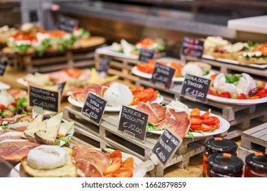 Various Snacks And Antipasti On The Table Of Showcase. Street Food Market In Florence, Italy.