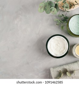 Various spa related objects on gray background, top view. Body and skin care flat lay with copy space. Beauty care concept