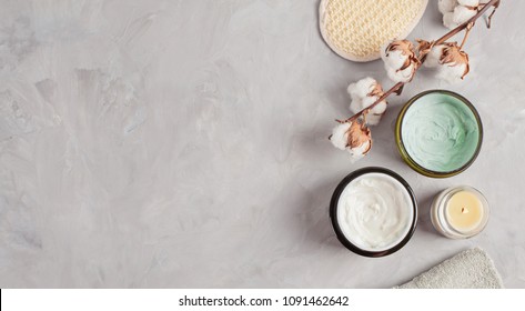 Various Spa Related Objects On Gray Background, Top View. Body And Skin Care Flat Lay With Copy Space. Beauty Care Concept