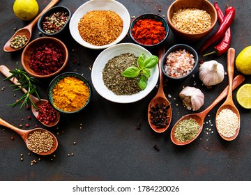 Various spices in a bowls on black concrete background. Top view copy space. - Shutterstock ID 1784220026