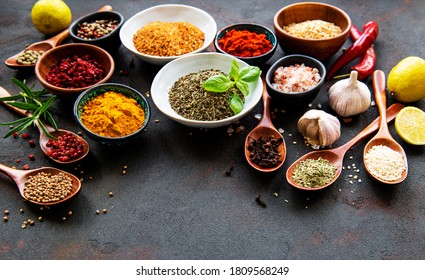 Various spices in a bowls on black concrete background. Top view copy space. - Shutterstock ID 1809568249