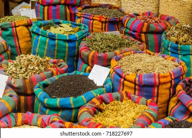 Various spices in colorful sacks on sale in the market, in Acre (Akko), Israel.
