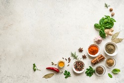Various Spices, Herbs And Condiments On White Stone Table, Top View, Copy Space. Healthy Cooking, Indian Food Background.
