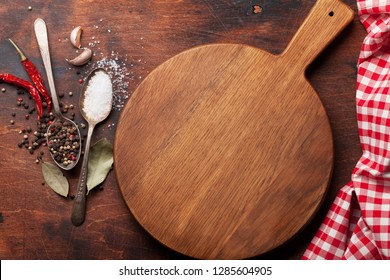 Various spices, herbs and cooking utensils on wooden background. Top view with space for your recipe. Flat lay - Powered by Shutterstock