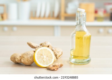 Various spices and Lemon on a wooden table. Herbal aromatic oil of Ginger, cinnamon, ginger on a wooden board. - Shutterstock ID 2193248885