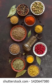Various Spices on dark background. Assortment, set of spices and condiments with pepper mill, top view, flat lay. Cooking food concept. - Shutterstock ID 1420647380