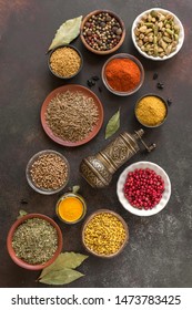Various Spices on dark background. Assortment, set of spices and condiments with pepper mill, top view, copy space. Cooking food concept. - Shutterstock ID 1473783425