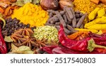 Various spices, peppers and herbs close-up top view. Eastern spice market. A set of peppers and spices for cooking.