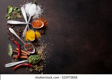 Various spices spoons on stone table. Top view with copy space - Powered by Shutterstock