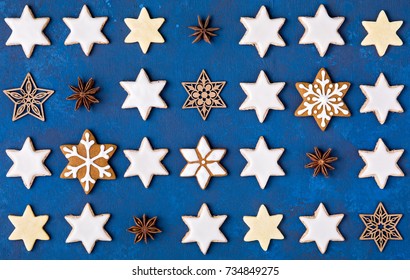 Various Star Cookies Christmas Pattern On A Blue Background.