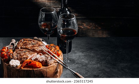 various steaks for a festive dinner for two with glasses of red wine - Powered by Shutterstock