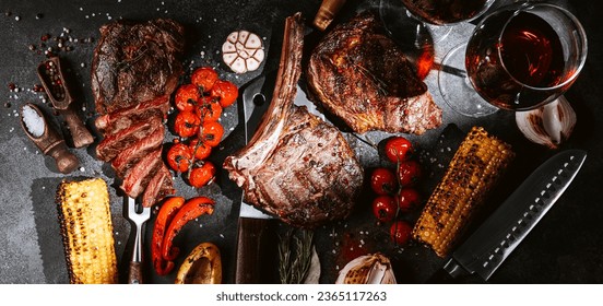 various steaks for a festive dinner for two with glasses of red wine - Shutterstock ID 2365117263