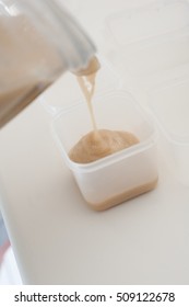 Various Steps Of A Home Cook Making Apple Sauce In A Blender