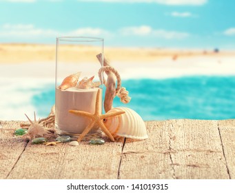 Various summer holiday items with blur beach on background - Powered by Shutterstock