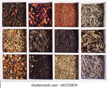 Various tea in a wooden box and scoops - Powered by Shutterstock