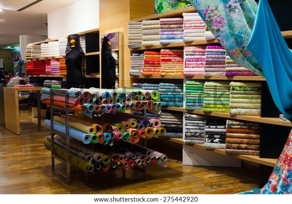various textiles for\
sale in fabric shop