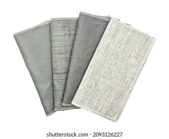 Various Texture Of Drapery Fabric Sample Swatch In Grey Tone Isolated On White Background With Clipping Path. Folded Linen Cloth Swatch For Selection. Interior Curtain Material Samples.