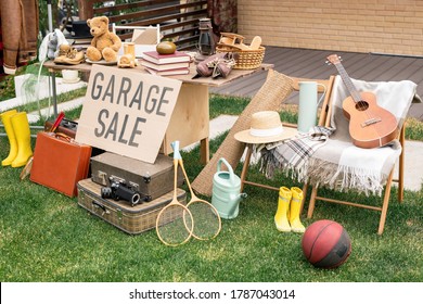 Various things placed on table and chairs in backyard, garage sale concept
