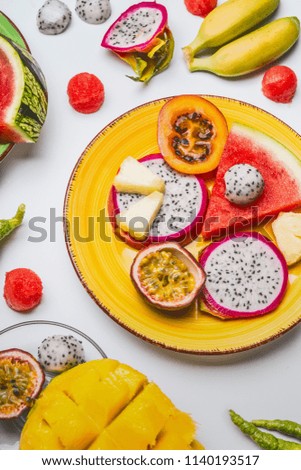 Similar – Image, Stock Photo Tropical fruits on blue plate