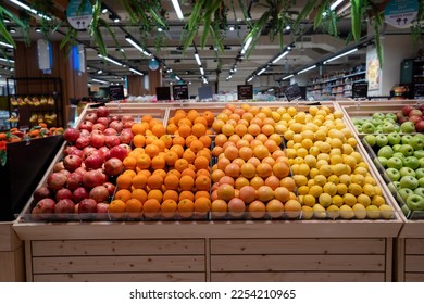 Various type of fresh fruits arrange neatly grocery store. Apple, Orange, Pomegranate, Lemon on rack.  - Shutterstock ID 2254210965