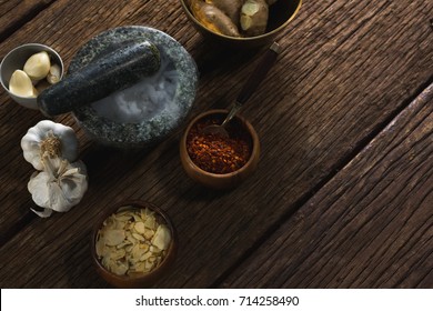 Various type of spices in bowl on wooden table - Powered by Shutterstock