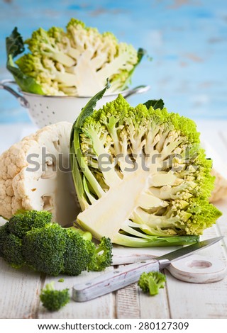 Various types of cabbage: romanesco, broccoli and cauliflower cabbage. Whole and cut in half