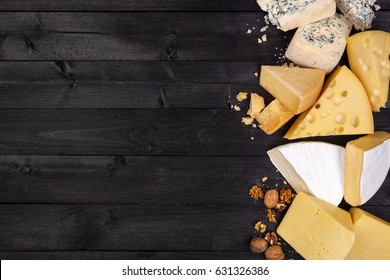 Various types of cheese on black wooden table. Top view. Copy space. - Powered by Shutterstock