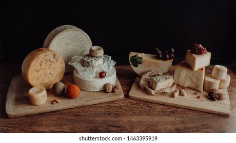various types of cheese on rustic wooden table