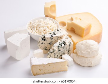 Various Types Of Cheeses On A White Background.