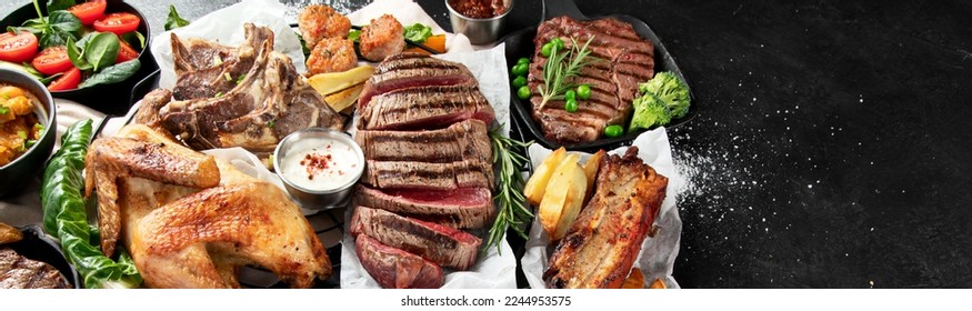 Various types of healthy cooked meat - beef, pork, chicken on a dark background with vegetables and salad. Top view. Panorama with copy space. - Shutterstock ID 2244953575