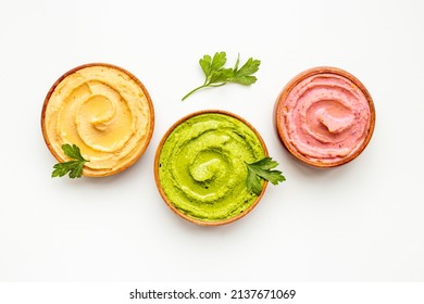 Various types of hummus with chickpeas spinach and beets. Flatlay top view