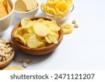 Various unhealthy snacks on white background