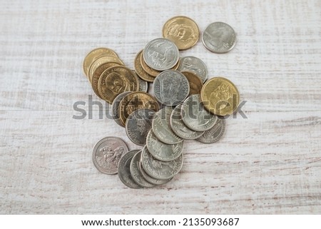 Various US coins, American coins on a wooden background.