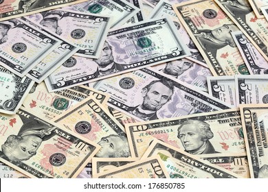 Various US Dollar Notes Scattered. Focus On Central Banknote.