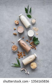 Various vegan plant based milk and ingredients, top view, copy space. Dairy free milk substitute drink, healthy eating. - Shutterstock ID 1356165836