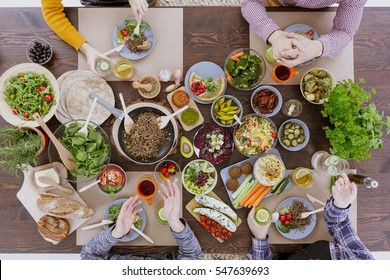 Various Vegan And Vegetarian Food Lying On Rustic Table